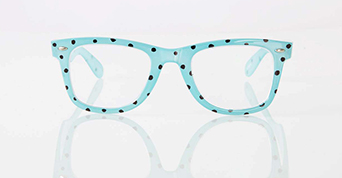Aqua blue eyeglasses with black polka dots on frame and white background.